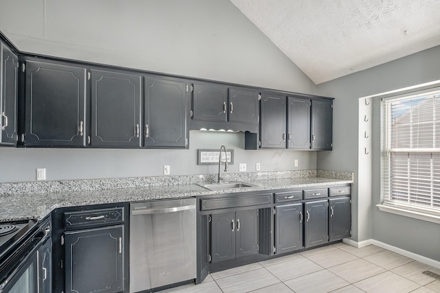 kitchen featuring dishwasher, vaulted ceiling, a wealth of natural light, and a sink