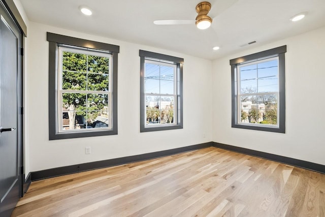 unfurnished room featuring light wood finished floors, visible vents, baseboards, ceiling fan, and recessed lighting