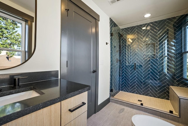 bathroom featuring vanity, visible vents, recessed lighting, tile patterned flooring, and a shower stall