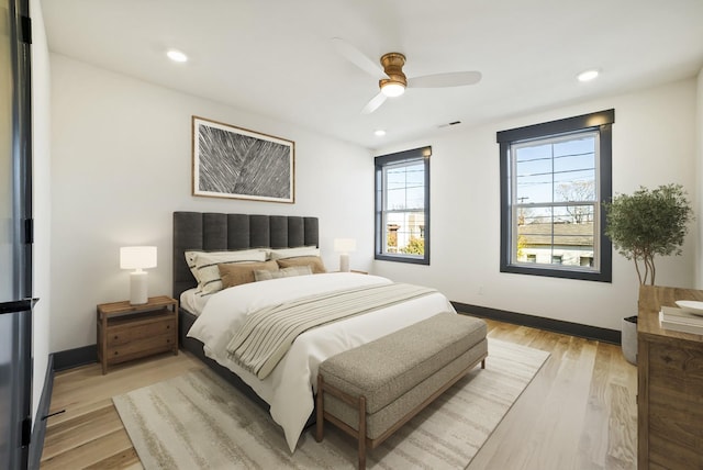 bedroom featuring recessed lighting, light wood-style flooring, and baseboards