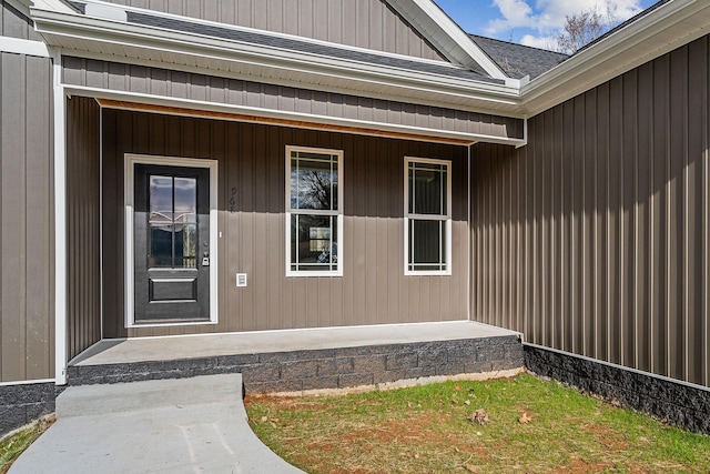 view of exterior entry featuring a porch