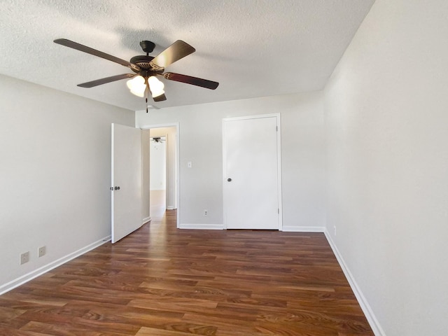 unfurnished bedroom featuring ceiling fan, baseboards, a textured ceiling, and wood finished floors