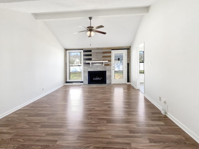 unfurnished living room with dark wood-type flooring, beamed ceiling, a ceiling fan, and baseboards