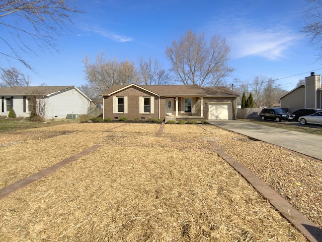 single story home featuring crawl space, an attached garage, driveway, and brick siding