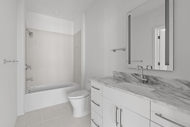 full bath with tile patterned floors, toilet, vanity, and bathtub / shower combination