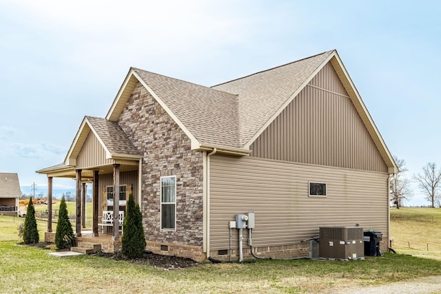 view of property exterior with a shingled roof, a yard, central AC unit, and crawl space