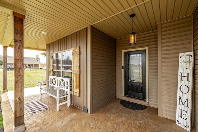 property entrance featuring covered porch