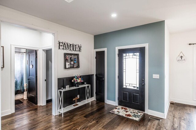 foyer entrance with recessed lighting, visible vents, dark wood-style flooring, and baseboards