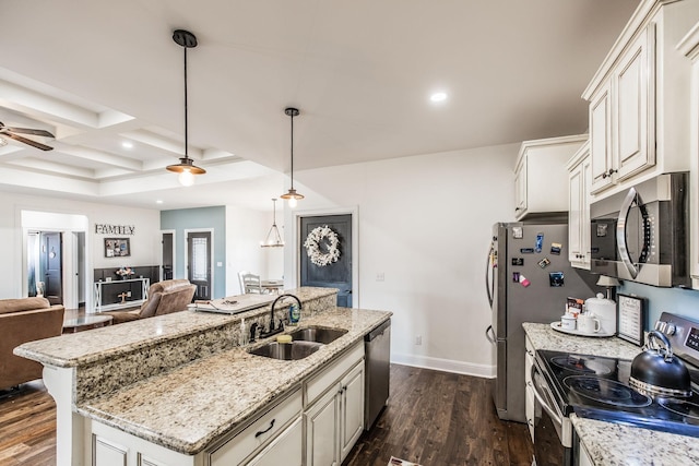 kitchen with a sink, coffered ceiling, open floor plan, dark wood finished floors, and stainless steel appliances