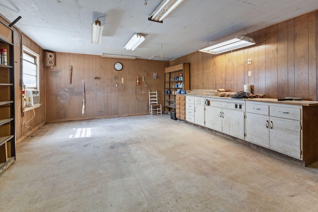 interior space with wooden walls, a workshop area, and cooling unit