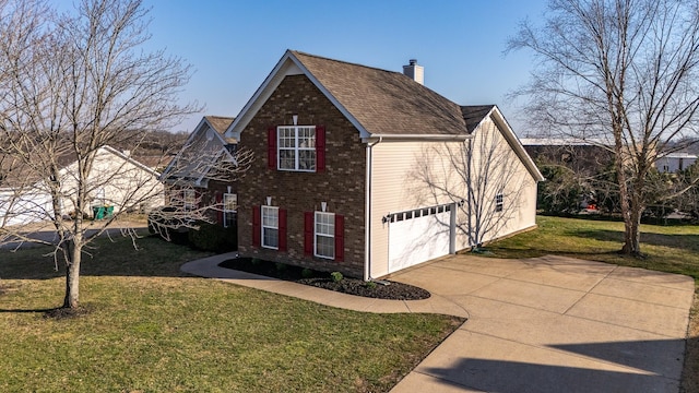 view of side of property featuring a yard, concrete driveway, a shingled roof, brick siding, and a chimney