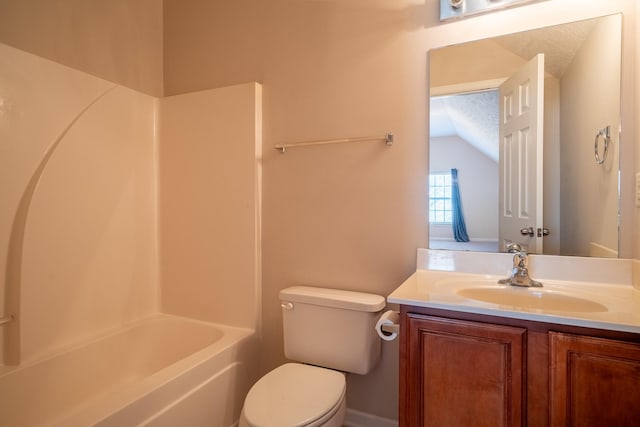 bathroom with toilet, vanity, lofted ceiling, and washtub / shower combination