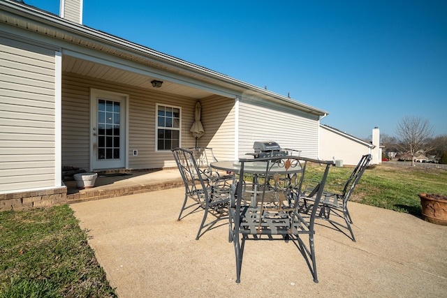 view of patio featuring grilling area and outdoor dining area