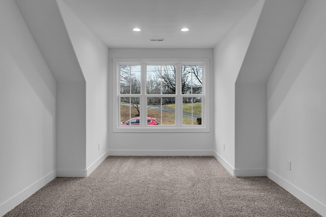 additional living space featuring visible vents, recessed lighting, baseboards, and carpet