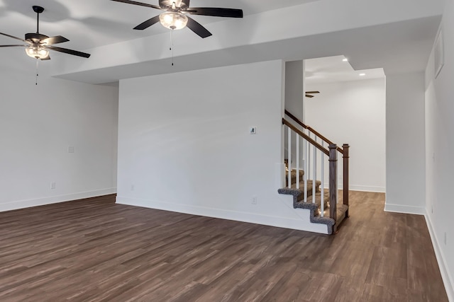 spare room with recessed lighting, baseboards, dark wood finished floors, and stairs