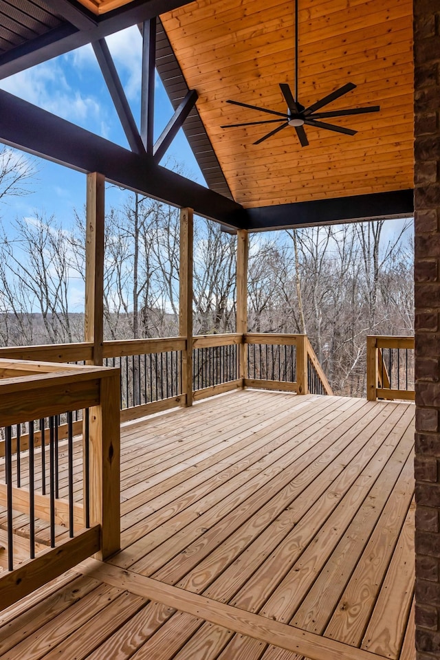 wooden deck featuring ceiling fan