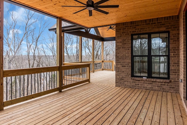 wooden deck featuring a ceiling fan