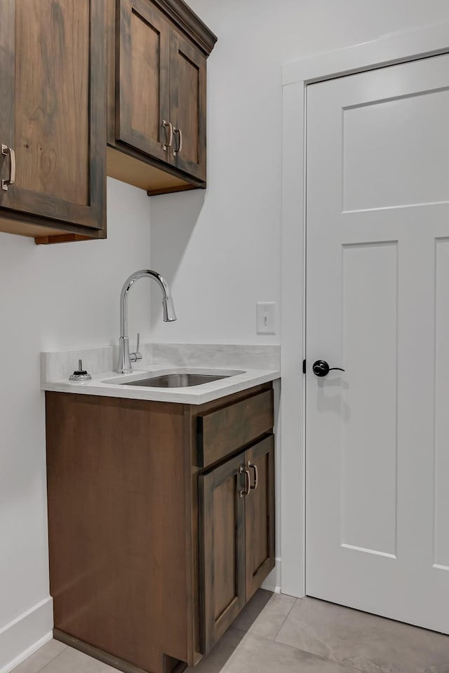 interior space with a sink and light tile patterned floors