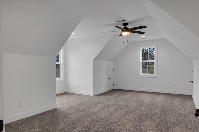 additional living space featuring ceiling fan, lofted ceiling, baseboards, and carpet floors