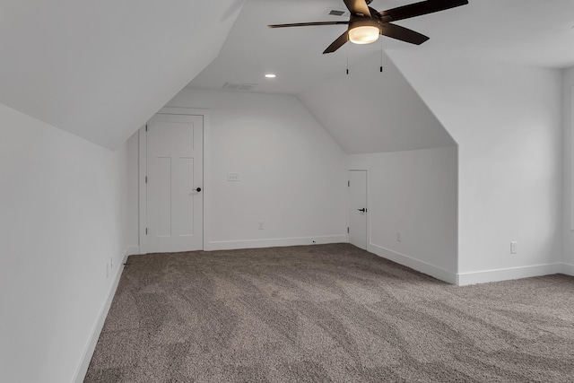 bonus room with carpet flooring, baseboards, and vaulted ceiling