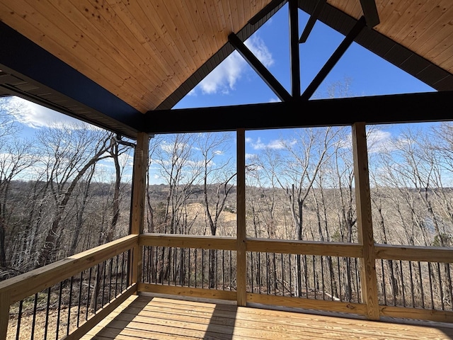 wooden deck featuring a view of trees