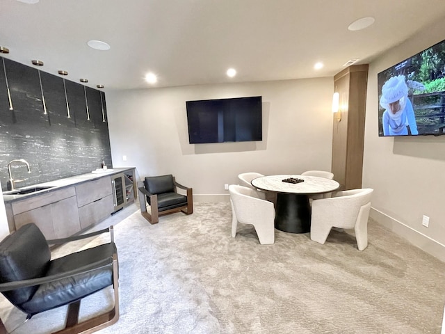 dining area with wine cooler, recessed lighting, light colored carpet, and baseboards