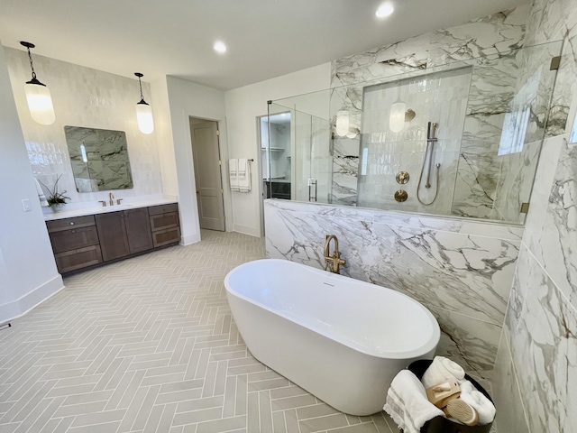 full bath with vanity, baseboards, a marble finish shower, recessed lighting, and a freestanding bath