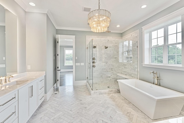 bathroom featuring vanity, baseboards, a stall shower, ornamental molding, and a notable chandelier