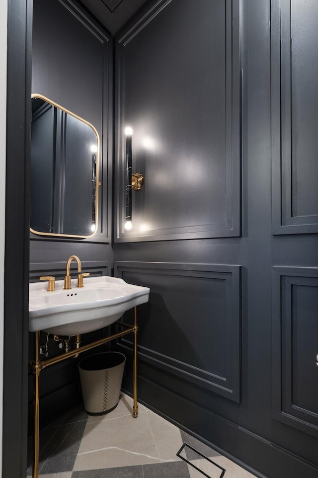 bathroom featuring a sink and tile patterned flooring