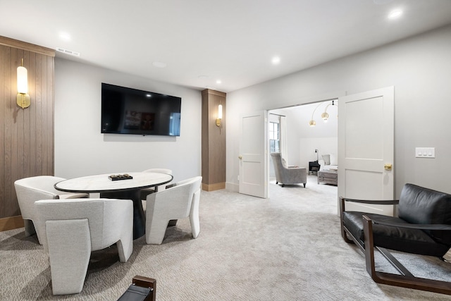 interior space featuring recessed lighting, visible vents, light colored carpet, and baseboards