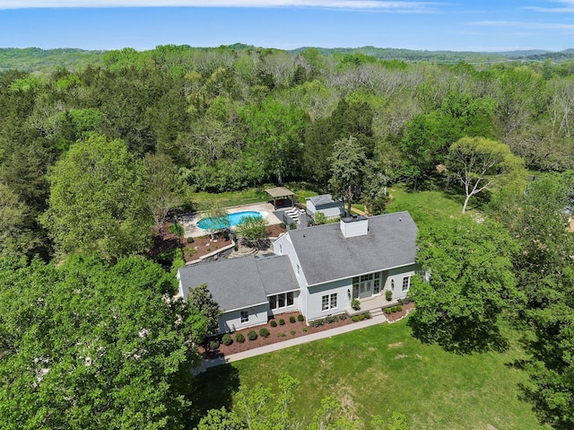 aerial view featuring a view of trees