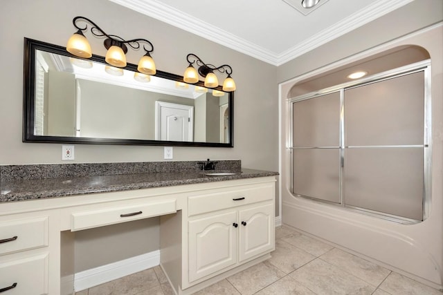 bathroom with tile patterned flooring, crown molding, baseboards, enclosed tub / shower combo, and vanity