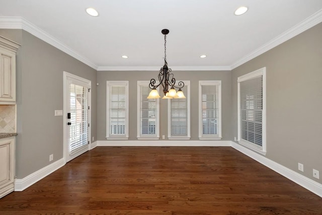 unfurnished dining area featuring baseboards, dark wood-style floors, and ornamental molding