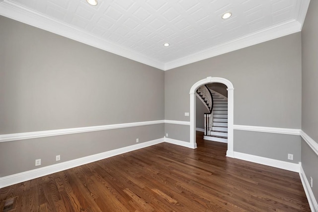 empty room with stairway, baseboards, dark wood finished floors, recessed lighting, and crown molding