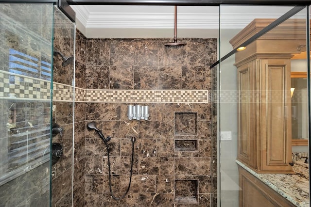 bathroom with a shower stall and crown molding