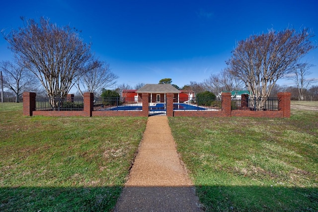 view of yard featuring a fenced in pool and fence