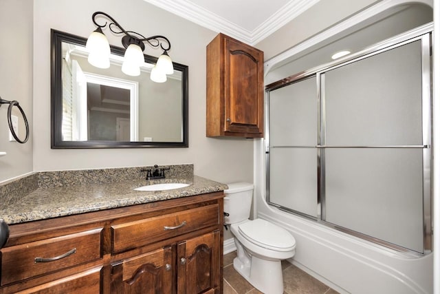 bathroom featuring tile patterned flooring, crown molding, toilet, combined bath / shower with glass door, and vanity