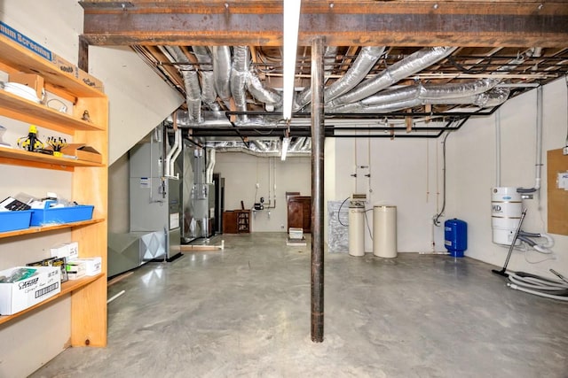 unfinished basement featuring heating unit