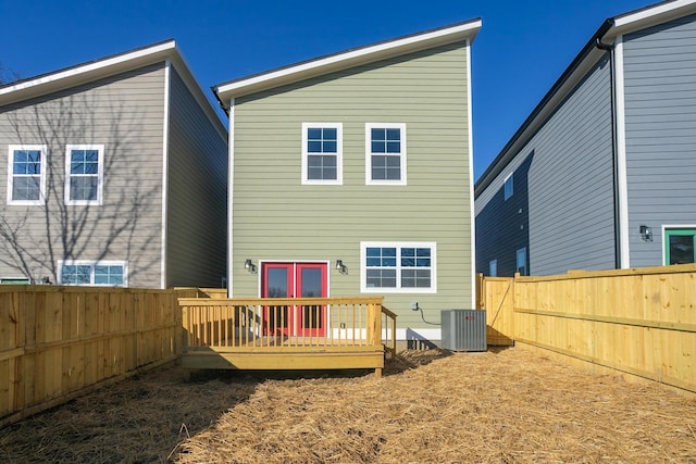 back of house with a deck, cooling unit, and a fenced backyard