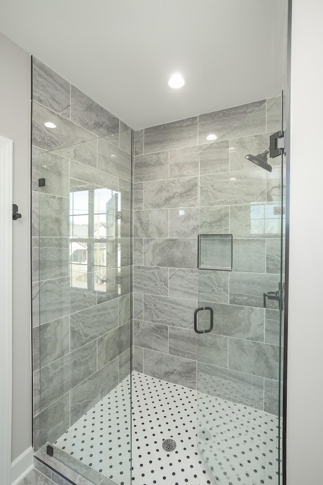 bathroom with a shower stall