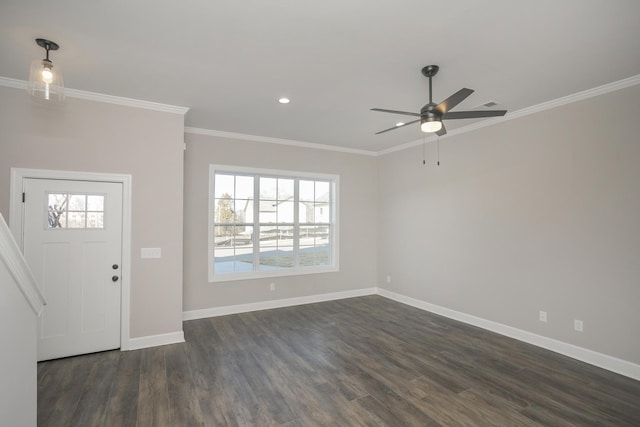 foyer featuring dark wood finished floors, recessed lighting, baseboards, and ornamental molding