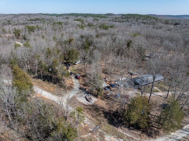 birds eye view of property with a wooded view