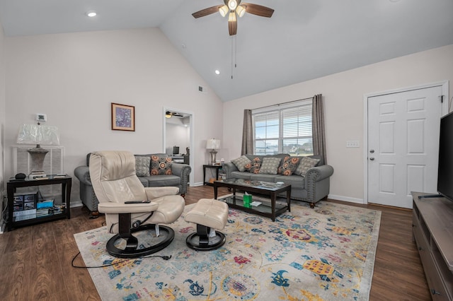 living area with dark wood finished floors, a ceiling fan, baseboards, and high vaulted ceiling