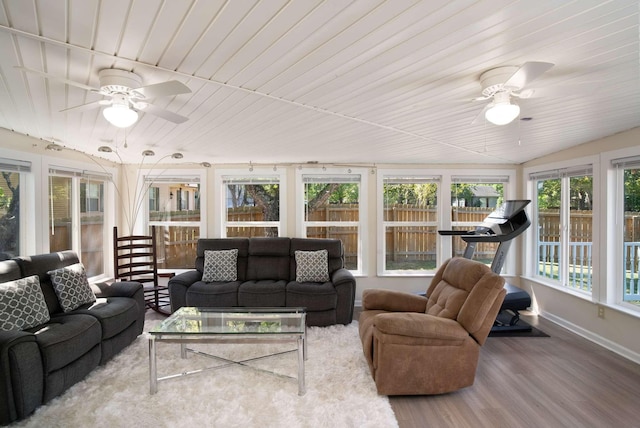 sunroom featuring wood ceiling and ceiling fan