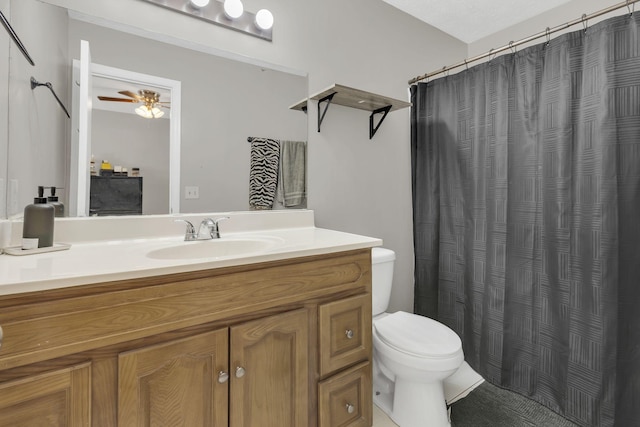 full bath with a shower with shower curtain, toilet, vanity, and ceiling fan