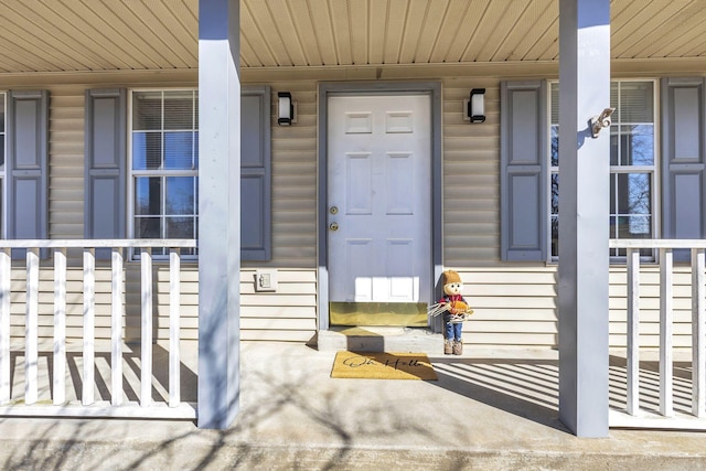 doorway to property with a porch