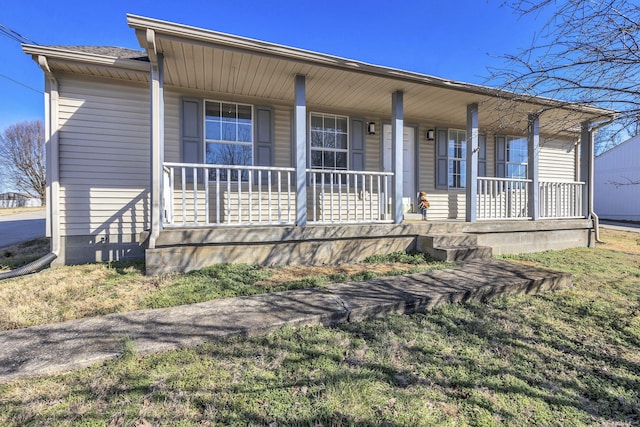 view of front of house featuring a porch and a shingled roof