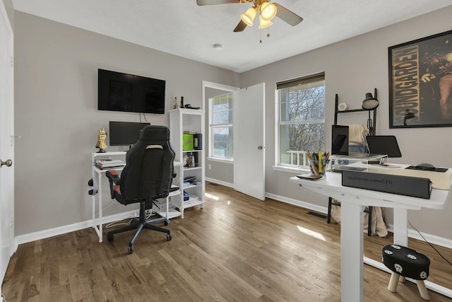 home office with ceiling fan, baseboards, and wood finished floors