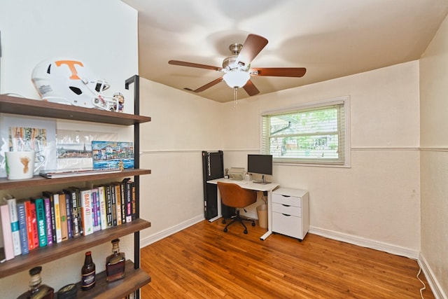 office featuring wood finished floors, baseboards, and ceiling fan