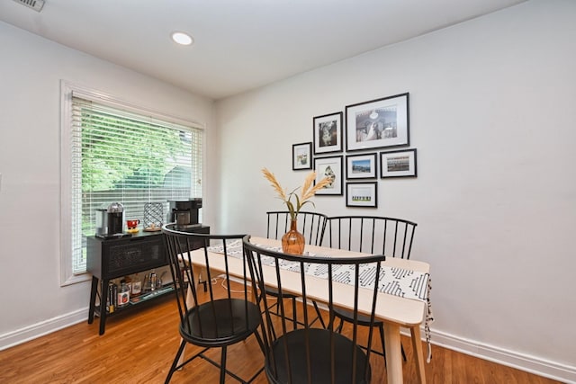 dining room with visible vents, recessed lighting, light wood-style floors, and baseboards